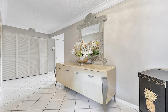 corridor with crown molding, light tile patterned flooring, and a textured ceiling