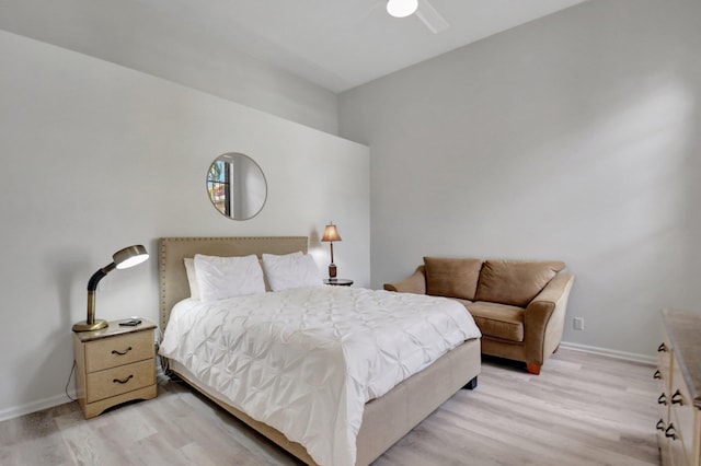 bedroom with light hardwood / wood-style flooring and ceiling fan