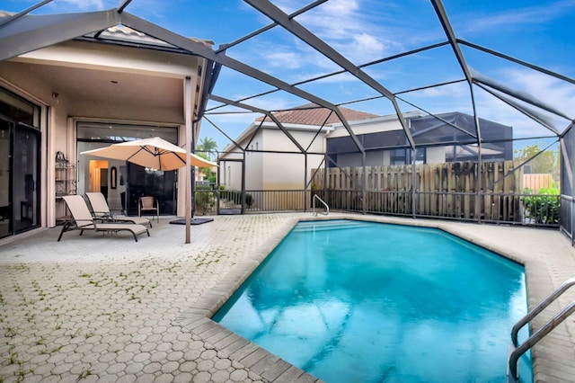 view of pool featuring a lanai and a patio