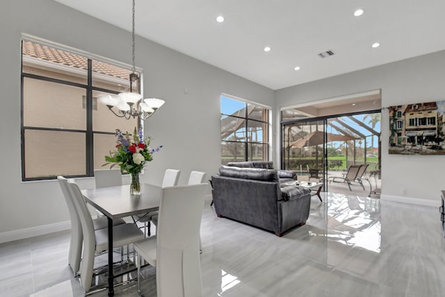 dining area featuring a notable chandelier