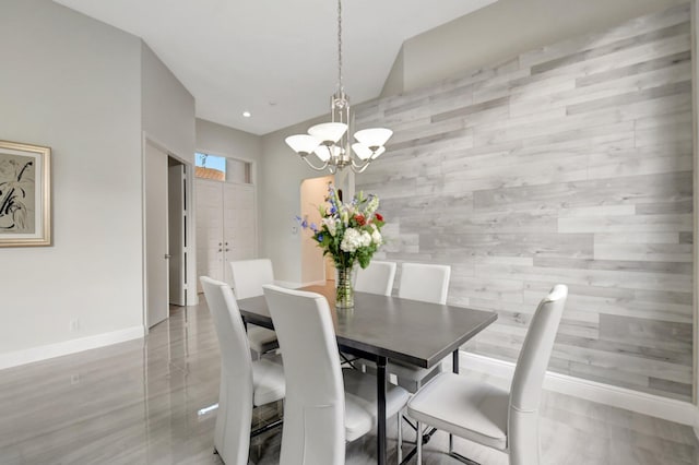 dining area featuring a notable chandelier