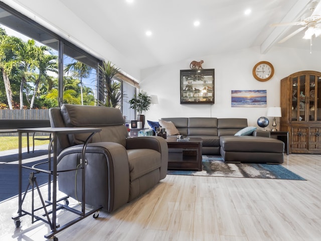 living room featuring lofted ceiling with beams