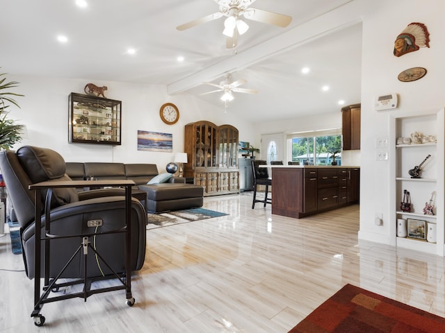 living room with ceiling fan and lofted ceiling with beams