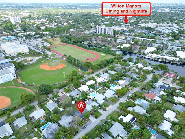 birds eye view of property with a water view