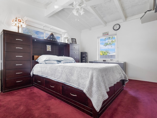 carpeted bedroom with ceiling fan and vaulted ceiling with beams