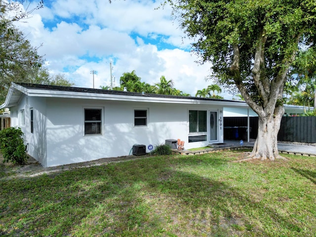 back of house with a yard