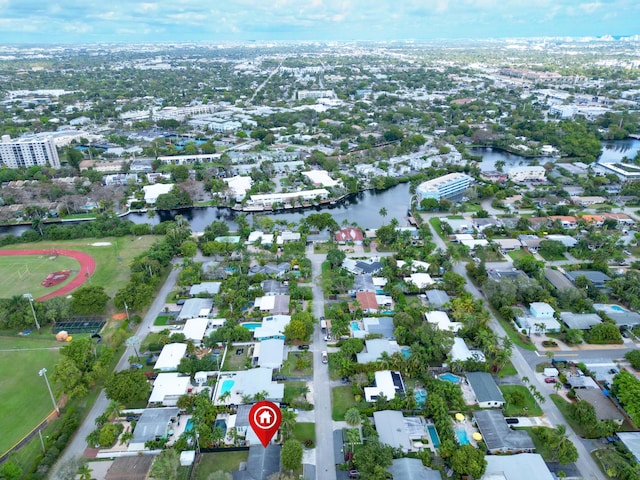 birds eye view of property with a water view