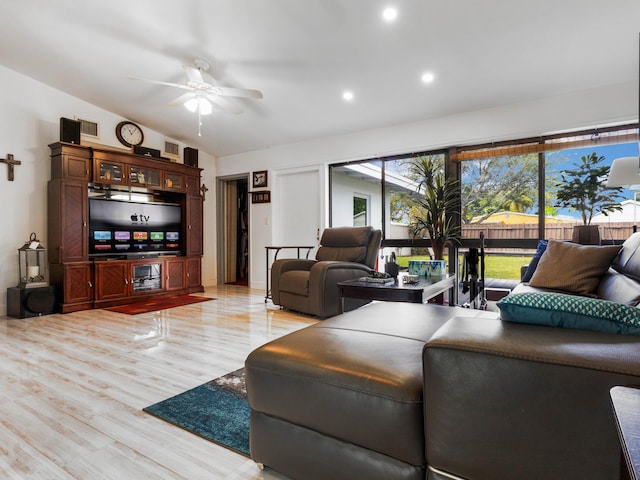 living room featuring light hardwood / wood-style floors and ceiling fan