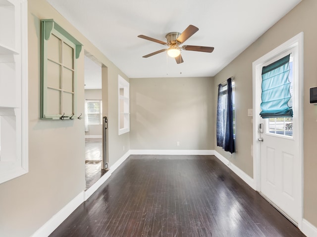 foyer featuring ceiling fan and dark wood-type flooring