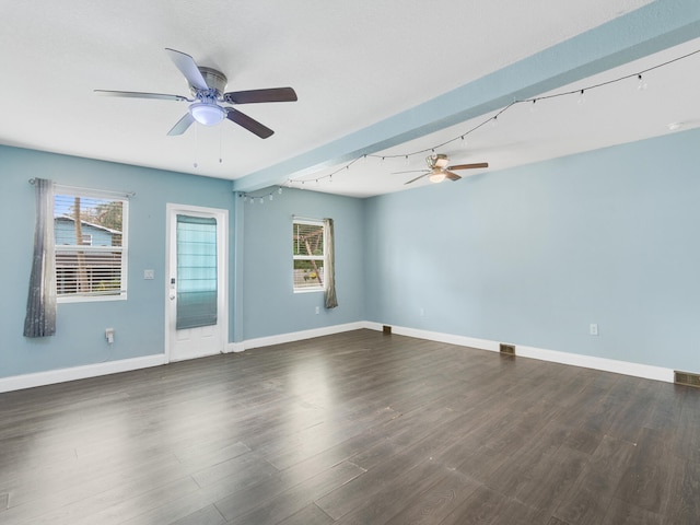 unfurnished room featuring ceiling fan and dark wood-type flooring