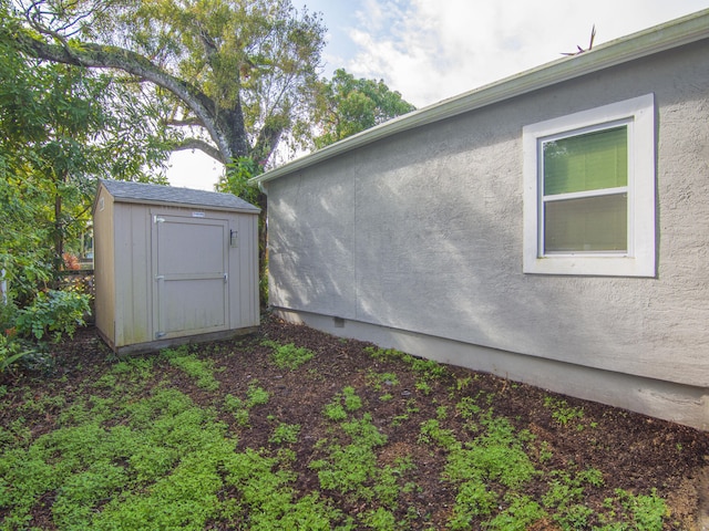 view of home's exterior featuring a shed