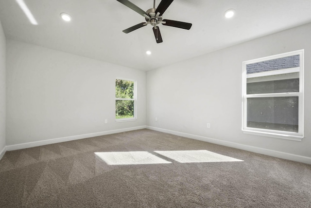 unfurnished room with carpet flooring and ceiling fan