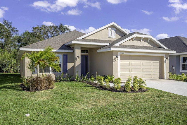 view of front facade with a garage and a front yard