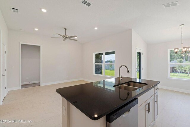 kitchen featuring sink, vaulted ceiling, light stone countertops, appliances with stainless steel finishes, and kitchen peninsula