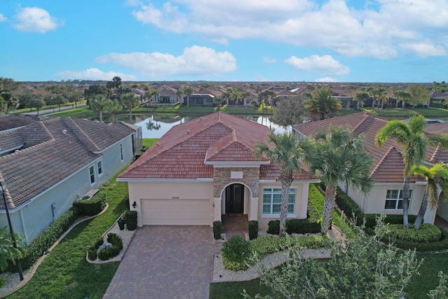 birds eye view of property with a water view