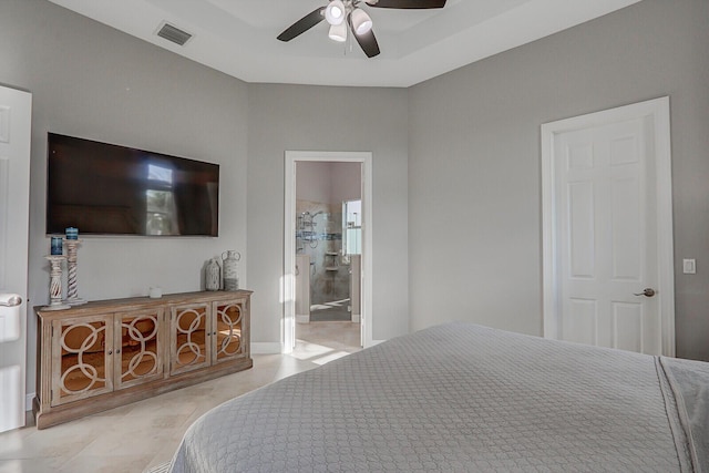 bedroom featuring ensuite bath and ceiling fan