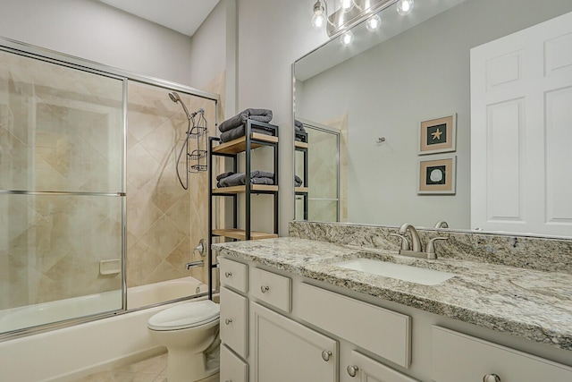 full bathroom with tile patterned flooring, vanity, toilet, and enclosed tub / shower combo