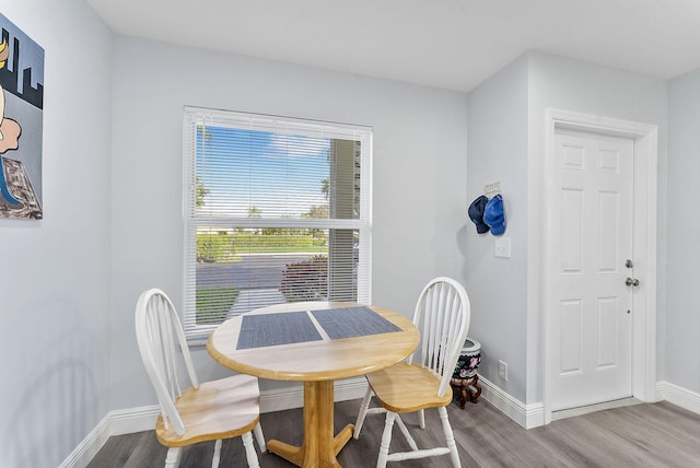 dining room with hardwood / wood-style flooring