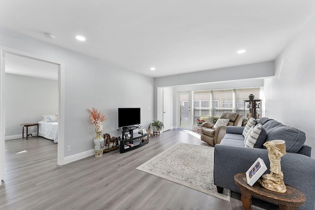 living room with light hardwood / wood-style flooring