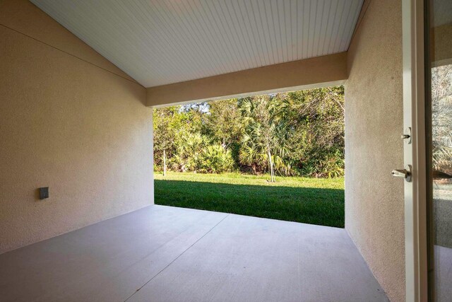 workout area featuring a healthy amount of sunlight and a textured ceiling