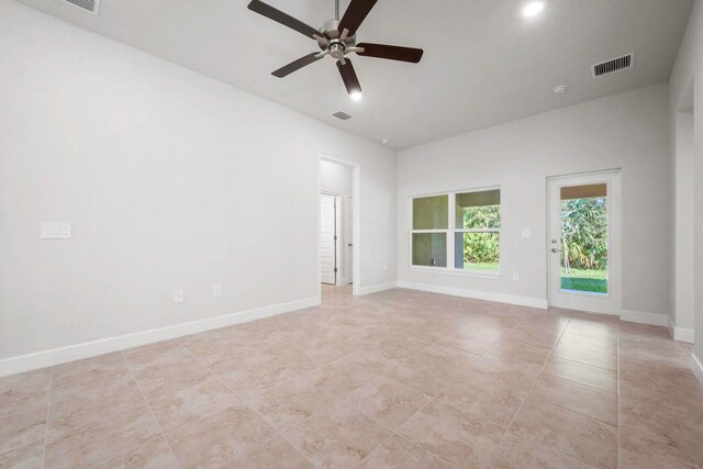 kitchen with sink, stainless steel appliances, a center island with sink, white cabinets, and ceiling fan with notable chandelier