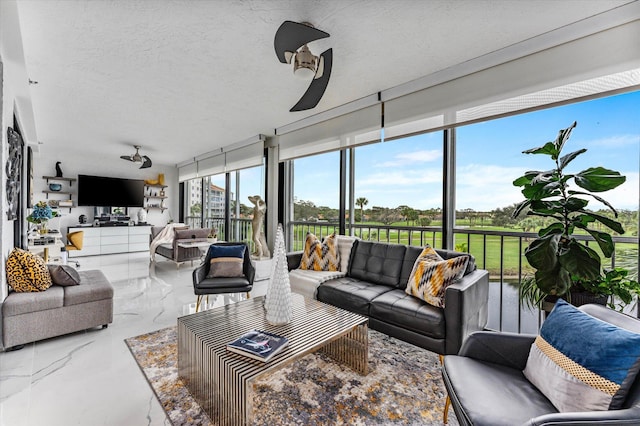 sunroom with ceiling fan