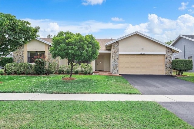 ranch-style house featuring a garage and a front yard