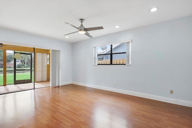 empty room with light hardwood / wood-style floors and ceiling fan