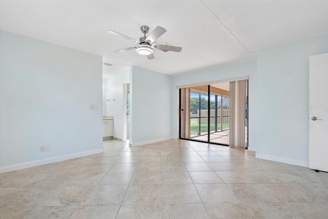 spare room featuring ceiling fan