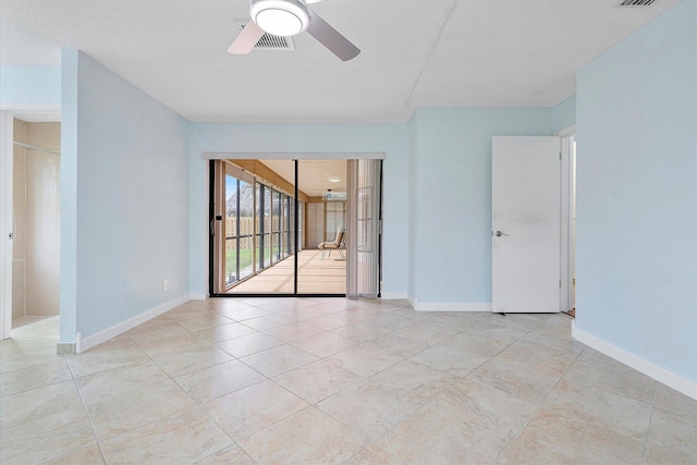 empty room featuring ceiling fan