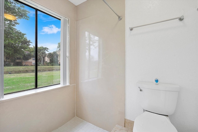 bathroom featuring tile patterned flooring and toilet