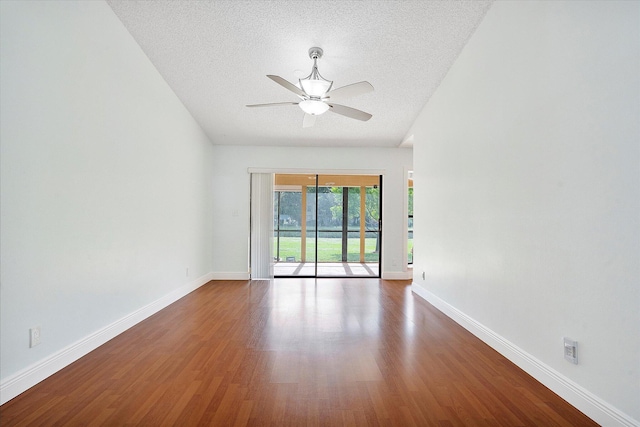 unfurnished room featuring a textured ceiling, ceiling fan, and dark hardwood / wood-style floors