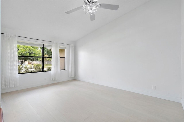 unfurnished room with vaulted ceiling and ceiling fan