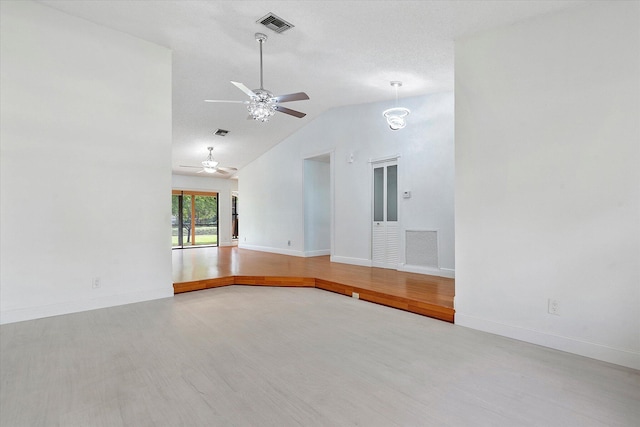 spare room with ceiling fan, wood-type flooring, and high vaulted ceiling