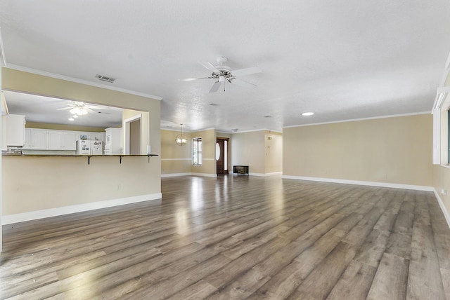 unfurnished living room with a textured ceiling, crown molding, hardwood / wood-style floors, and ceiling fan with notable chandelier