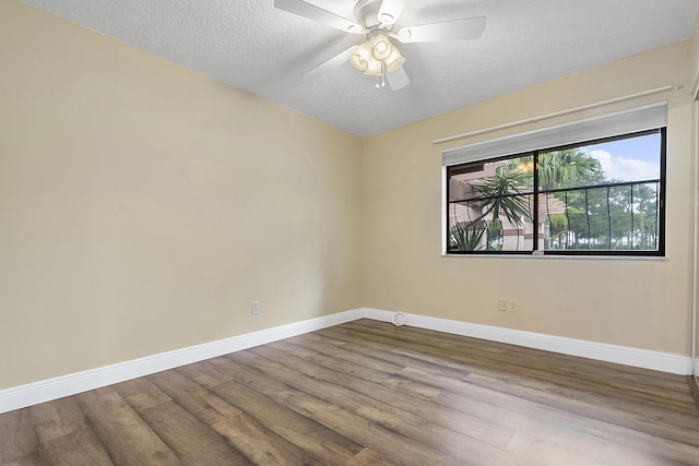 unfurnished room with ceiling fan, hardwood / wood-style floors, and a textured ceiling