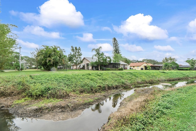 view of yard with a water view