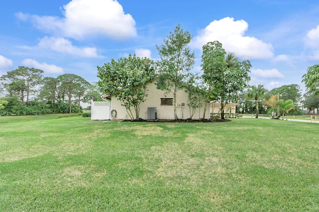 view of yard with central AC