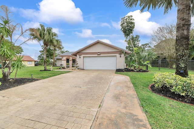 view of front facade featuring a garage and a front lawn