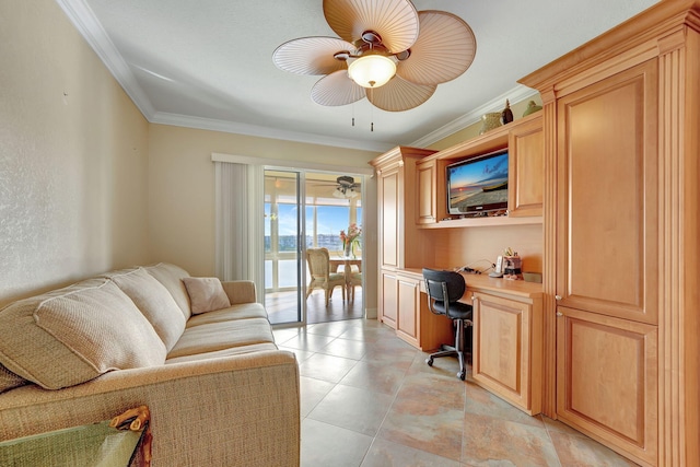 office with ceiling fan, built in desk, and crown molding