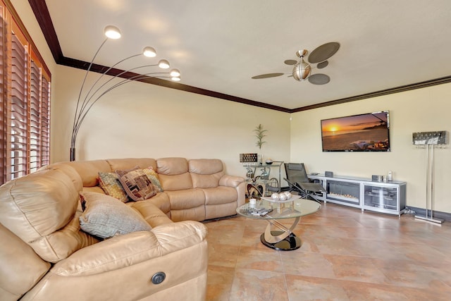 living room with ceiling fan and ornamental molding