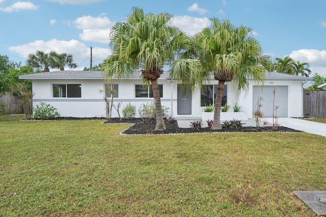 view of front of house with a garage and a front yard