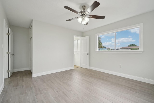 unfurnished bedroom with light wood-type flooring and ceiling fan