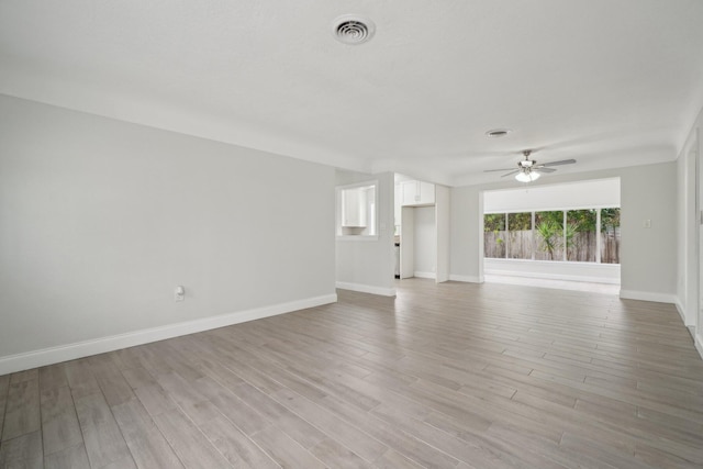 unfurnished living room with ceiling fan and light hardwood / wood-style floors