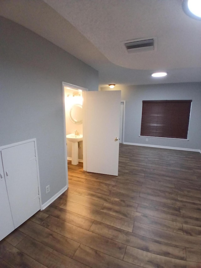 empty room featuring dark hardwood / wood-style floors