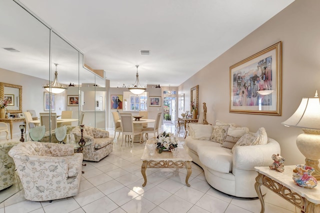 living room with visible vents and light tile patterned flooring