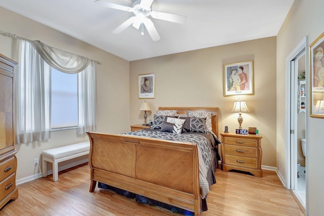 bedroom with a ceiling fan, light wood-type flooring, and baseboards