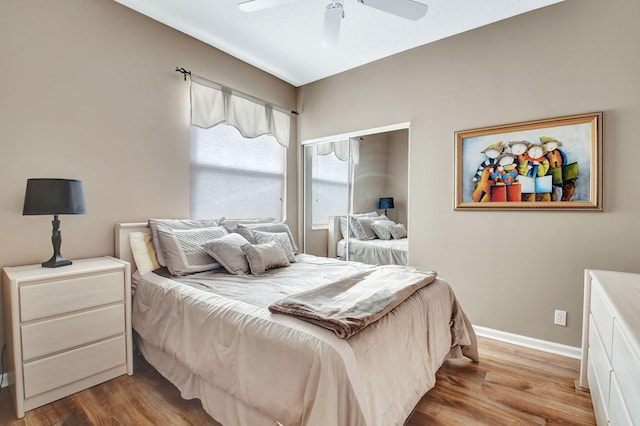 bedroom featuring hardwood / wood-style floors and ceiling fan