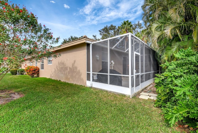 exterior space featuring a yard and stucco siding