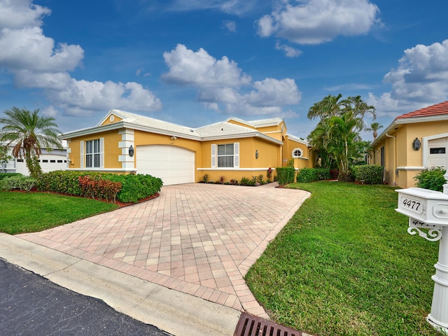 ranch-style home with a tiled roof, a front yard, stucco siding, decorative driveway, and a garage